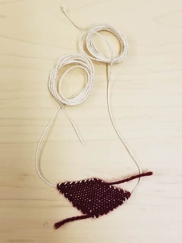 Woven diamond with warp threads tightened